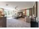 Spacious main bedroom boasts large windows, a ceiling fan, and neutral decor creating a peaceful retreat at 684 Magnolia Acres Ln, Fuquay Varina, NC 27526