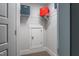 Functional storage closet with shelves and a lower door for easy organization and access at 684 Magnolia Acres Ln, Fuquay Varina, NC 27526