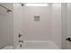 Bright bathroom featuring white subway tile, bronze fixtures, and a built-in shower niche at 70 Water Willow Ln, Zebulon, NC 27597