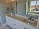 Elegant bathroom featuring dual sinks, quartz countertops, and modern fixtures at 70 Water Willow Ln, Zebulon, NC 27597