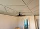 Elegant bedroom with stylish tray ceiling, ceiling fan, and modern lighting fixtures at 70 Water Willow Ln, Zebulon, NC 27597