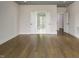 Spacious room with hardwood floors, double doors to closets, and ensuite entrances at 70 Water Willow Ln, Zebulon, NC 27597
