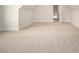 Large bonus room featuring carpet and neutral walls, offering a versatile space for various activities at 70 Water Willow Ln, Zebulon, NC 27597