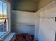 Well-lit closet with built-in shelving and a window view at 70 Water Willow Ln, Zebulon, NC 27597