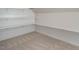Closet space with carpet, built-in shelving and rods at 70 Water Willow Ln, Zebulon, NC 27597