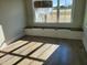 Charming dining area with built-in bench seating and storage beneath the window at 70 Water Willow Ln, Zebulon, NC 27597
