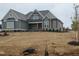 Inviting home featuring neutral siding and architectural roof detail at 70 Water Willow Ln, Zebulon, NC 27597
