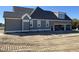 Exterior view showing the back of the house and the garage area under construction at 70 Water Willow Ln, Zebulon, NC 27597