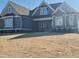 Charming home with a well-manicured lawn and inviting architectural details at 70 Water Willow Ln, Zebulon, NC 27597