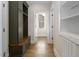 Hallway view of mudroom and storage space, with view to exterior at 70 Water Willow Ln, Zebulon, NC 27597