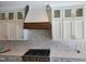 Stylish kitchen with white cabinets, subway tile backsplash, and stainless steel range at 70 Water Willow Ln, Zebulon, NC 27597