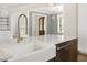 Farmhouse sink with gold faucet and stainless steel dishwasher set in the kitchen island with marble countertop at 70 Water Willow Ln, Zebulon, NC 27597