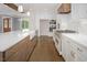Modern kitchen featuring a large island, stainless steel appliances, and a farmhouse sink at 70 Water Willow Ln, Zebulon, NC 27597