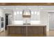 Gourmet kitchen with a spacious island, custom cabinetry, and stainless steel appliances at 70 Water Willow Ln, Zebulon, NC 27597