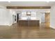 Open-concept kitchen with a large island, modern appliances, and hardwood floors at 70 Water Willow Ln, Zebulon, NC 27597