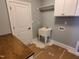 Functional laundry room features a utility sink, cabinetry, and ample counter space at 70 Water Willow Ln, Zebulon, NC 27597