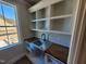 Laundry room with built in shelving and stainless steel utility sink at 70 Water Willow Ln, Zebulon, NC 27597