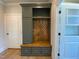 Mudroom with custom built-in hall tree bench and ample storage, perfect for organization at 70 Water Willow Ln, Zebulon, NC 27597