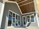 Covered patio featuring a stained wood ceiling, offering the perfect outdoor living space at 70 Water Willow Ln, Zebulon, NC 27597