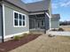 Exterior view highlighting the screened-in porch and the rear of the house at 70 Water Willow Ln, Zebulon, NC 27597