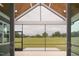 Screened-in porch with a vaulted wood ceiling overlooking a spacious yard at 70 Water Willow Ln, Zebulon, NC 27597
