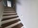 Staircase with white risers and wood treads at 70 Water Willow Ln, Zebulon, NC 27597