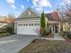 Charming one-story home with a two-car garage, well-maintained lawn, and welcoming front entrance at 117 Rosedale Creek Dr, Durham, NC 27703