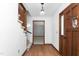 Bright entryway featuring hardwood floors and a staircase with plush carpeting at 223 Coachlight Trl, Burlington, NC 27215