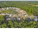 An elevated view highlighting the community's well-spaced homes, manicured lawns, and lush surrounding greenery at 27 Asti Ct, Clayton, NC 27527