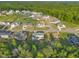 A beautiful aerial view of a well-maintained community with lush green spaces and stunning single-Gathering homes at 27 Asti Ct, Clayton, NC 27527