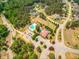 Aerial view of the neighborhood pool and clubhouse with ample parking spaces at 27 Asti Ct, Clayton, NC 27527