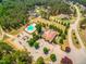 Aerial view of the community pool and clubhouse with lovely landscaping at 27 Asti Ct, Clayton, NC 27527