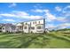 Well-maintained backyard showcasing the home's exterior, screened porch, and lush green lawn at 27 Asti Ct, Clayton, NC 27527