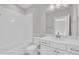 Bathroom with white subway tiles, white sink cabinet, toilet and shower/tub at 27 Asti Ct, Clayton, NC 27527