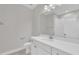 Bright bathroom features white marble floor, sink cabinet with brushed gold hardware, and white subway tile shower at 27 Asti Ct, Clayton, NC 27527