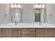 Bathroom with double vanity, framed mirrors, and tiled floors at 27 Asti Ct, Clayton, NC 27527