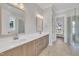 Luxurious bathroom featuring a double vanity, granite counters, and tiled shower at 27 Asti Ct, Clayton, NC 27527