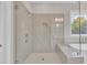 Large glass walk-in shower offering a relaxing at home spa experience at 27 Asti Ct, Clayton, NC 27527