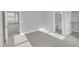 Bright bedroom with carpet, and open door that leads to a bathroom and a walk-in closet at 27 Asti Ct, Clayton, NC 27527