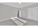 Bedroom with large closet, gray carpet, light gray walls and natural lighting at 27 Asti Ct, Clayton, NC 27527