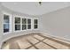 Bedroom bathed in natural light with big windows and wood floors at 27 Asti Ct, Clayton, NC 27527