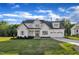 Charming two-story home featuring a lush green lawn and an attached two car garage at 27 Asti Ct, Clayton, NC 27527