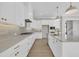 Gourmet kitchen with sleek appliances, modern cabinets, and a center island for entertaining at 27 Asti Ct, Clayton, NC 27527