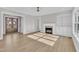 Spacious living area featuring a fireplace, built in shelves and a large front door at 27 Asti Ct, Clayton, NC 27527