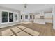 Spacious room featuring the living room and the kitchen with its large windows at 27 Asti Ct, Clayton, NC 27527