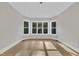 Sun-filled room with bay windows and sleek hardwood floors at 27 Asti Ct, Clayton, NC 27527