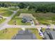 A newly constructed home with a three car garage in a new subdivision. Aerial view from above the roofline at 5124 Grist Stone Way, Youngsville, NC 27596