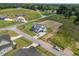 Newly constructed home sits on a corner lot with large front and side yards in a rural subdivision. Aerial view at 5124 Grist Stone Way, Youngsville, NC 27596
