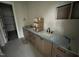 Bathroom with a long vanity with double sinks and plenty of storage at 5124 Grist Stone Way, Youngsville, NC 27596
