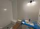 Bright bathroom featuring walk-in shower, modern vanity, and new toilet at 5124 Grist Stone Way, Youngsville, NC 27596